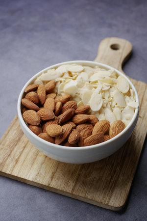 top view of almond nut and slice in a bowl on tableの写真素材