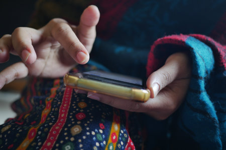 close up of women hand holding smart phoneの写真素材
