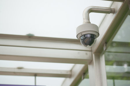 CCTV security camera operating outdoorの写真素材