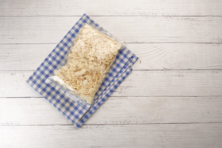 top view of almond nut slice in a packet on tableの写真素材