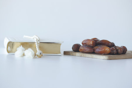 Holy book Quran and rosary on table, close up.の写真素材