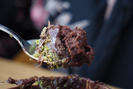 dark chocolate cream cake on spoon