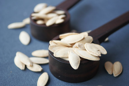 Dry Healthy organic Pumkin Seeds on wooden Spoon .の写真素材