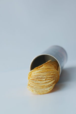 potato chips spilling form a packet on table