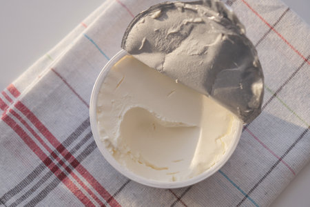 top view of milk cream in a container on tableの写真素材