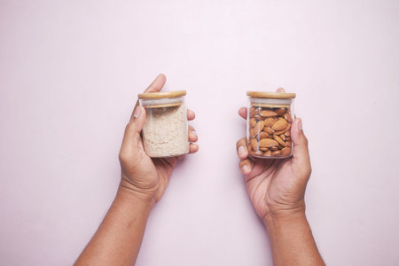 almond powder and almond in a jar on table,