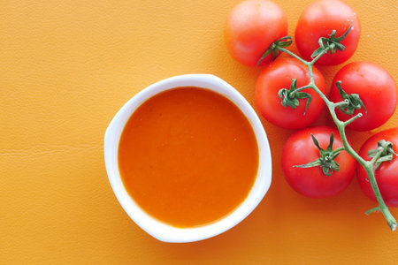 fresh tomato soup on tableの写真素材