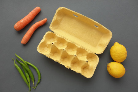 egg carton without eggs on table ,