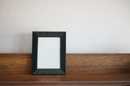 empty frame on table against a wallの写真素材