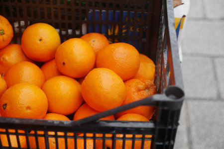 close up of slice of orange fruits in a bowlの写真素材