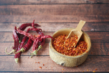 top view of chili flakes in a bowl on table