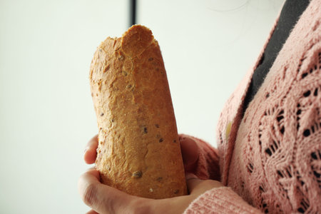 Baguette bread in hand with copy space