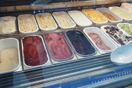 chocolate, vanila and orange favor of ice cream display for saleの写真素材