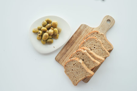 Turkish Grilled olives in a bowl and breads on table