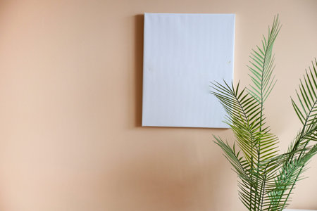 Black frame mockup in a living room hanging on a wall