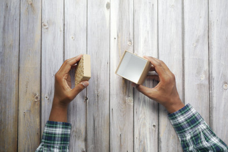 top view of person open a empty small gift box