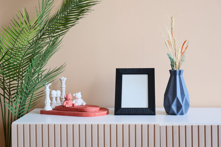 Black frame mockup on cabinet in front of the empty clean
