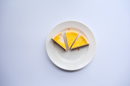 top view of slice of cheese cake on a plateの写真素材