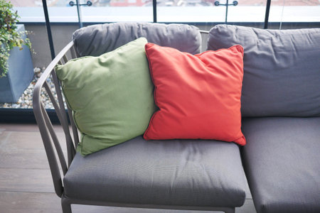 modern grey sofa with colorful pillows in living room at home