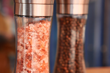 Raw dried pink Himalayan salt in glass vialの写真素材