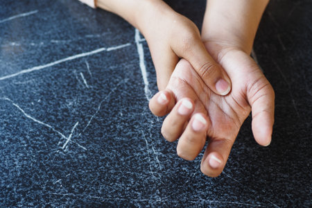 Young women hands suffering wrist pain,の写真素材