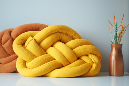 orange and yellow pillows on tableの写真素材