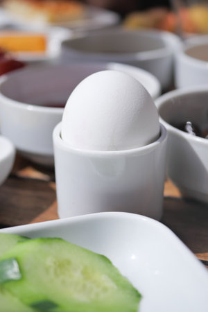 Close egg in cups for morning breakfastの写真素材