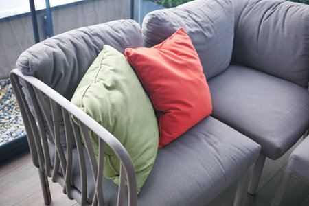 modern grey sofa with pillows in living room at homeの写真素材