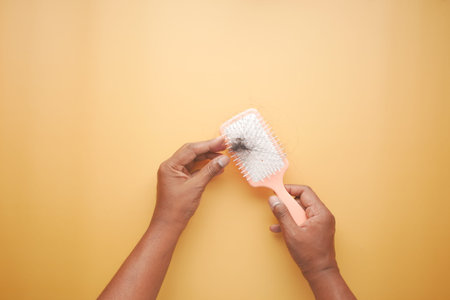 top view of man hold his list hair