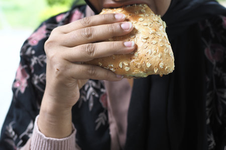 women mouth eating a sandwichの写真素材