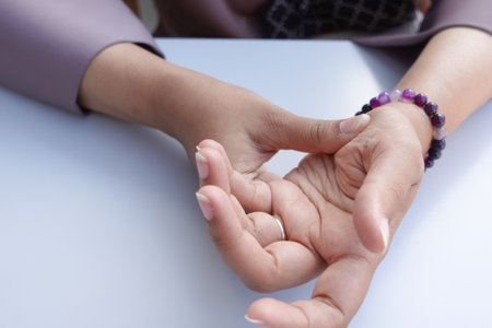 Young women hands suffering wrist pain,の写真素材