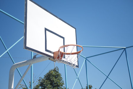 empty Basketball court against blue sky