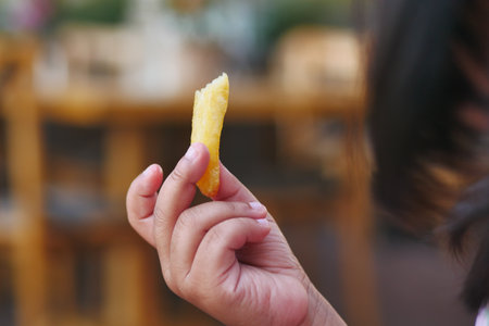 child eating french fries close upの写真素材