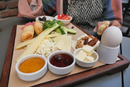 turkish breakfast of cheese, cucumber, egg, olive and tomatoの写真素材