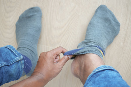 men put on gray color light socksの写真素材