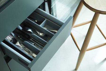 cutlery fork with knife and spoon in a drawerの写真素材