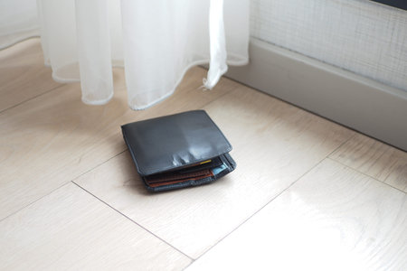 left wallet on floor at home