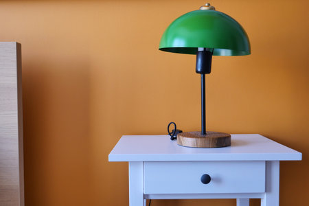 table lamp against orange color wall in bed roomの写真素材