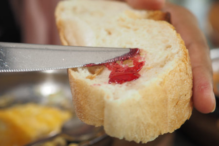 blue berry jam on bread on table,の写真素材
