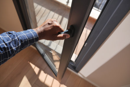 hand open gray plastic pvc window at home at early morningの写真素材