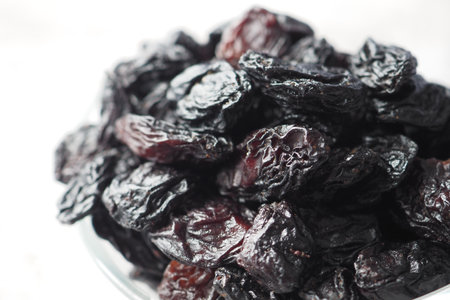 black raisin on white background, close up,の写真素材