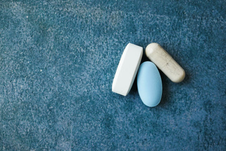 colorful pills and capsules on black backgroundの写真素材