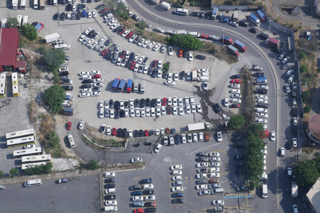 turkey istanbul 12 june 2023. top view of cars parking in outdoor parking area in bright sunny day.のeditorial素材
