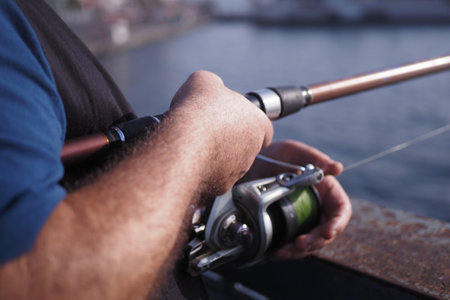 Fisherman with rod, spinning reel ,の写真素材