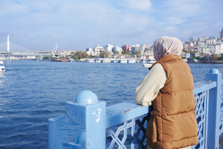 Unhappy girl standing at bench .の写真素材
