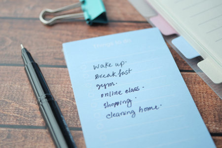 writing on a daily planner on table.の写真素材