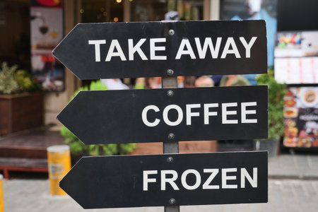 A sign at a coffee shop offering different types of coffee.の写真素材