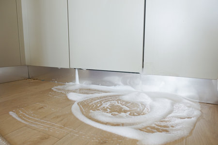 Spilled Water from a Dish Washer On Kitchen Floorの写真素材