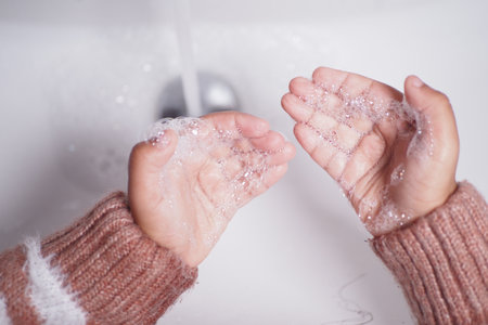 child washing hands with soapの写真素材