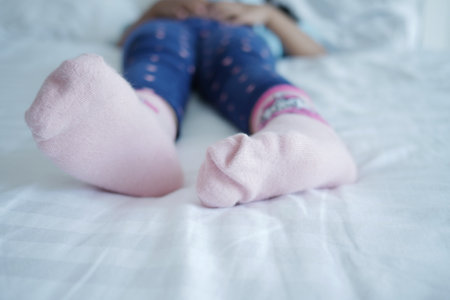 a colorful soft socks on child feet .の写真素材